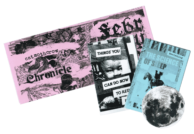 A tri-fold, heavily collaged newsletter zine printed on pink paper. The collaged image we can see is of art-nouveau figures bobbing in water, and text reading "catmothcrow chronicle" and part of "February", obscured by a paper cut out of the full moon and 2 mini zines in the foreground - one titled "Things You Can Do to Resist ICE" and one titled "Revisiting THE SCIENCE OF SLEEP". 